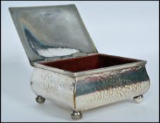 A Danish silver plated table top cigarette case having twin tower mark with P lettering. Together