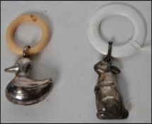 A vintage white metal babies rattle and teether  i