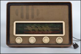 A vintage mid 20th century 1950s wooden cased Sobell 515 series valve radio model 515P havig glass
