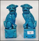 A pair of Oriental ceramic temple lion dogs of Fu