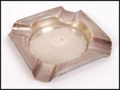 A silver hallmarked ashtray by Walker & Hall having engine turned decoration. Hallmarks for