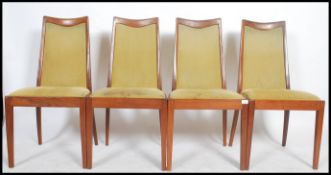 A set of 4 G-plan teak high back chairs in emerald upholstery.