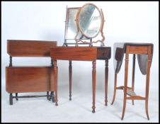 An Edwardian mahogany double drop leaf sutherland table together with a Victorian mahogany
