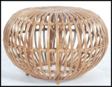 A retro 20th century wicker stool / pouffe entirel