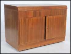 A 1950's hinged top walnut gramaphone hi fi style cabinet with twin doors having sectional