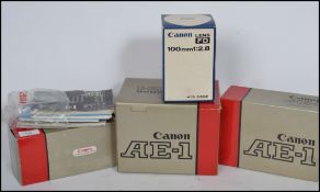 A collection of camera's to include a Canon AE-1 in original box, Canon 50/1.8 lens with box, a