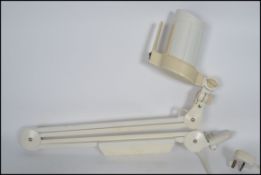 A vintage 20th century retro industrial / medical 1001 lamps Luxo LHH-50K wall mounted anglepoise