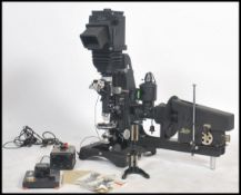 An unusual 1950s German Leitz very large photo microscope of ebonised metal construction with camera