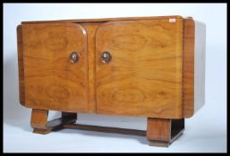 A 20th century walnut Art Deco sideboard having a