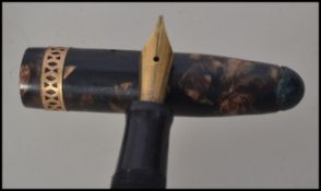 A collection of vintage 20th century pens and propelling pencils with coloured lead. To include a