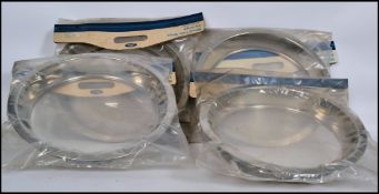 An original set of 4 chrome wheel trims for a Ford Capri being complete in the original packaging.