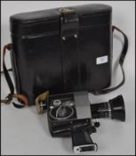 A vintage Bollet Paillard P4 Swiss Cine automatic camera in original black leather fitted case.