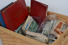 A large good collection of vintage and antique postcards some in albums, some loose dating from