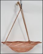 A 1930's French Art Deco pressed glass light shade, the shallow dish form shade decorated with a