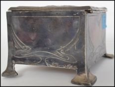 A stunning Art Nouveau inspired vintage 20th century desk top silver plated cigarette box, raised on