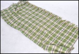 A vintage mid 20th century Irish  woven tartan  woolen blanket having a green and white tartan