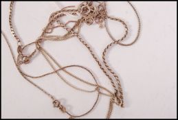 A collection of silver necklaces and silver bracelets some stamped 925. Total weight 12.2g
