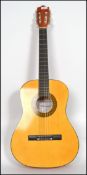 A three quarter size six string acoustic guitar by