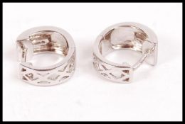 A pair of ladies 14ct white gold earrings of creol