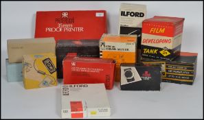 A collection of vintage camera equipment to include a Ilford Dy-Drum processing tank, Nebro