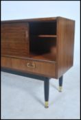 A 1960's E Gomme  ( early G-Plan ) teak wood and ebonised Librenza sideboard having drawers,