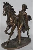 After Guillaume Coustou, a marly horse with woman walking alongside in a bronzed finish with marking