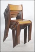 A set of eight 1950 / 60's steel tubular stacking chairs with panel seats and backs