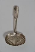 A Georgian silver caddy spoon with shell shaped bowl. Unmarked weighs 8.4 grams.