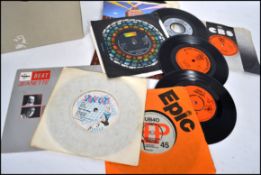 A collection of 45rpm vinyl record singles dating from the 1960's to include several artists such as