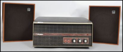 A vintage 1960's portable four speed Bush record player together with a pair of teak cased vintage