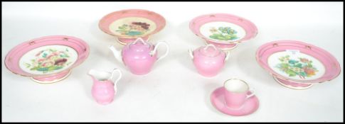 A group of four 19th century ceramic tazza's having hand painted floral decoration, the tazzas of
