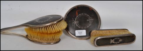 A silver hallmarked ladies dressing table set comprising mirrors and brushes etc. Each with