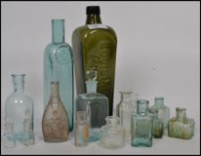 A collection of 19th century and other glass bottles to include medicine bottles, ink bottles, a