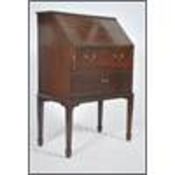An Edwardian / early 20th century mahogany bureau writing desk having fall front slope with