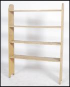 An early 20th century country painted pine open window bookcase dresser shelf with remains of