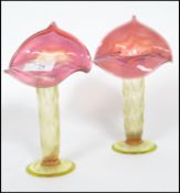 A pair of late 19th Century Stourbridge glass Jack in the Pulpit vases with wide folded cranberry