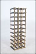 A retro 20th century brass metal  and ebonised pine wine rack with with enough space for thirty