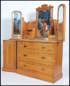 An Edwardian satin walnut dressing table chest of drawers having short over deep drawer