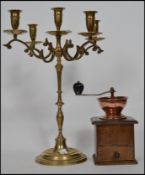 A vintage table centre brass five point candelabra together with a vintage wooden and copper
