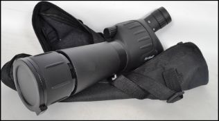 A Prismatic angled zoom spotting scope for GNAS archery 20 - 60 x 60 zoom along with pair of vintage