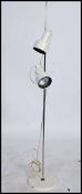 A 1980's retro adjustable twin spot chrome floor standing spot light lamp with pendant shades and