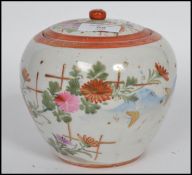 A group of Oriental Japanese ceramics to include a lidded ginger jar, a lidded temple vase raised on