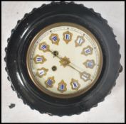A late 19th century French Comptoise bulls eye wall clock with ebonised and gilt dial inlaid with