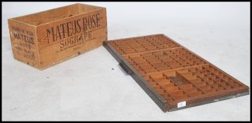 A 19th century printers tray together with a vintage Rose wine advertising wooden crate bearing