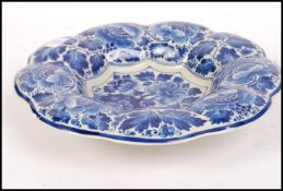 A 20th century Delft large ceramic bowl with paint