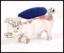 A silver 20th century pin cushion in the form of a
