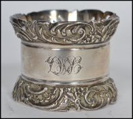 A large silver hallmarked napkin ring with plain b