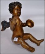 An early 20th century bronze cherub winged putti m
