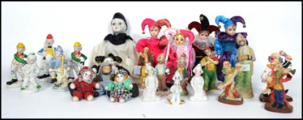 A collection of ceramic clown figurines along with