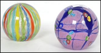 A pair of oversized early 20th century paperweight